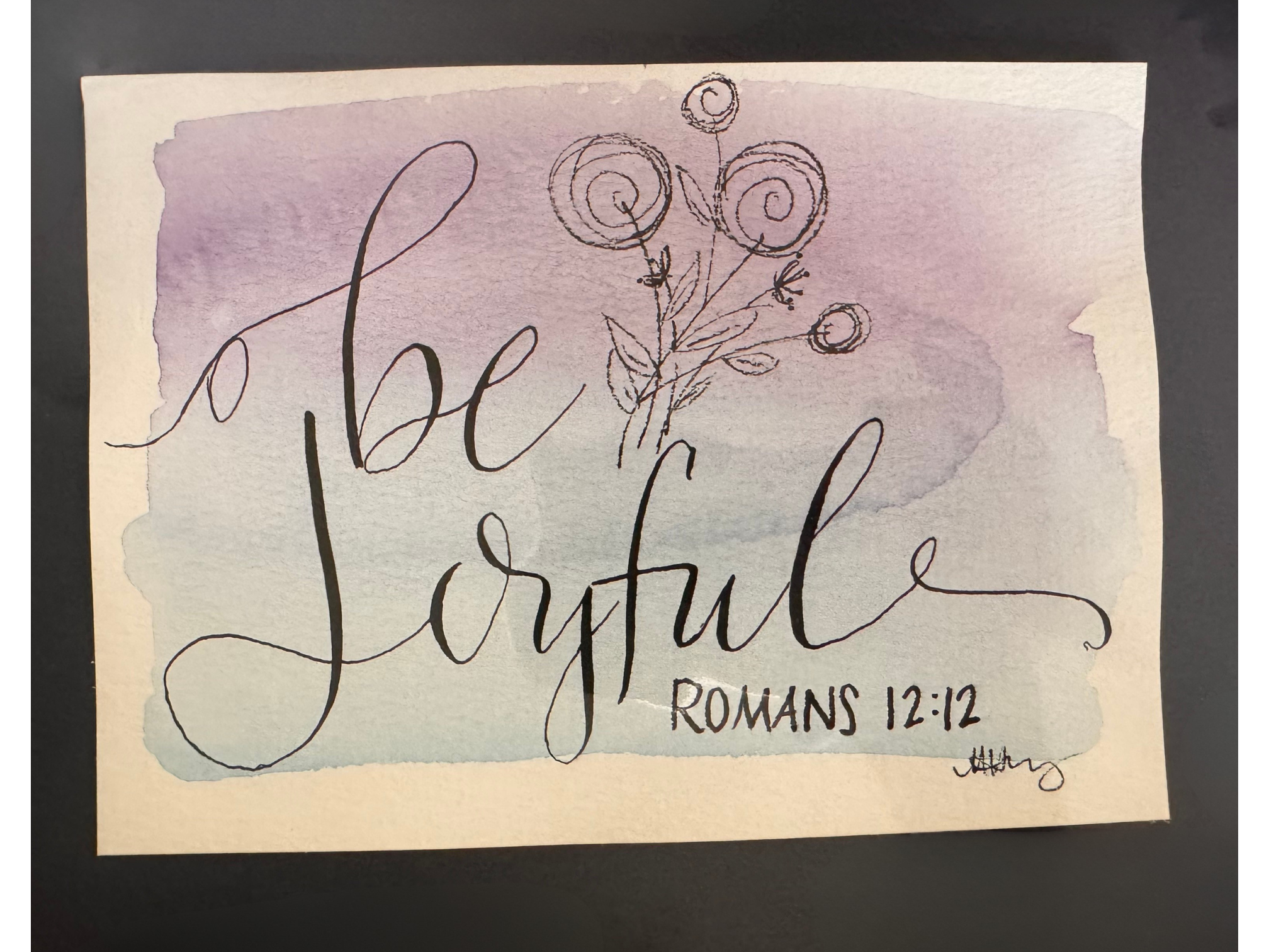 photograph of Be Joyful calligraphy piece
